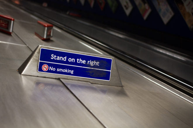 Escalator sign saying "Stand on the right"